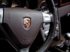 Porsche’s black stallion is a prestigious moniker on this brown leather steering wheel