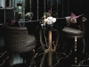 The space makes extensive use of mirrors to contrast its dark surfaces and reflect the outside | Photo Courtesy of Celia Sawyer