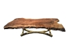 Saghian mixes in eye-catching pieces, such as this golden metallic hand chair and driftwood coffee table, to illicit “Oh! Where did you find that?” responses from those who enter his eclectically-tasteful spaces