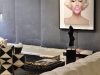 Saghian mixes in eye-catching pieces, such as this golden metallic hand chair and driftwood coffee table, to illicit “Oh! Where did you find that?” responses from those who enter his eclectically-tasteful spaces