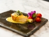Chilean sea bass on corn sauce with purple kale guanciale and cherry tomatoes