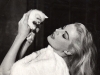 Anita Ekberg plays with a kitten moments before her famous Trevi Fountain scene in La Dolce Vita. Collection Of Christoph Schifferli