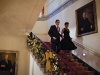 President Barack Obama and First Lady Michelle Obama descend the Grand Staircase of White House to attend a holiday party, Dec. 13, 2009.