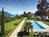 Just 35 minutes from Geneva, this sumptuous 21,000 sq. ft. residence is hidden out of sight on a three-hectare estate, which includes rare species of trees and is enclosed by a wall with a wrought-iron fence.