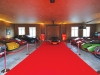 Recognized as one of Canada’s most prestigious car collectors, Jim Williams displays his fleet of cars in a designer showroom garage with red-carpet ropes.