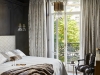 Coutas showcases her love of fine materials in all of her designs. Exhibit A: the lush bedroom filled with textures, light and striking design elements | Photo by Francis Amiand