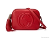 SOHO LEATHER DISCO BAG: Featuring a hanging tassel, this small shoulder bag from Gucci also has a zipper-top closure, an embossed, timeless Gucci logo on one side, internal slip pockets and an adjustable shoulder strap. Made in Italy.