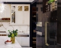 Studio 93 used a 5-foot-wide fireplace instead of the traditional 3-foot version to increase the openness between the living and dining rooms, with Calacatta and Nero Marquina marble on the main floor | Photo Courtesy Of Studio 93