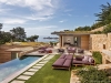 Lobos Views: With its dramatic perch overlooking Monterey Bay and Point Lobos, the residence's natural materials of stone and exposed wood make it appear one with the hillside |  Photo credit: Bob Canfield Photography