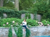 Amanda Lang perches on the ledge of her swimming pool. She spends her days treading the deep waters of the business world. Photography By Christoph Strube Of Judy Inc.