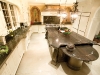 The opulent open-concept kitchen boasts four of only 16 slabs of granite in Canada with copper mineral veining.