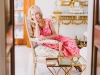 Suzanne Rogers takes a seat in her Forest Hill home. She wears a top and skirt by Simone Rocha