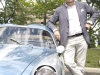 Andrea Zagato leans against Sean Collins\' 1958 Fiat Abarth Zagato 750GT Corsa.