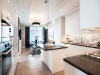 The Elegant Suite features a custom kitchen by Downsview, integrated Miele appliances and a fireplace