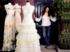 Alma standing with dress mannequins.
