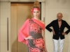 This Asian-inspired dress with exposed shoulder reveals Riva\'s love for clean lines.