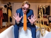 Michael Wekerle sits on the edge of his bathtub in the spacious master suite of his elegant Forest Hill home