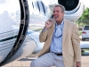 Venture capitalist Bobby Genovese takes a quick call before jet-setting from his home in the Bahamas to the BG Capital Group headquarters in Florida.