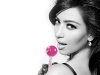 Kardashian poses with her trademark pop.