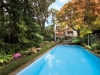 The backyard features a pool, landscaping designed by Walter Kehm and a phenomenal view of the Wolf House’s three-storey glass façade
