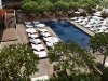 Aerial shot of The Modern Honolulu\'s Sunrise Pool, with its earthy wooden deck. Photography by: Evan Dion.